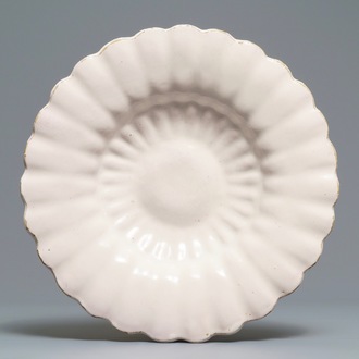 A white Dutch Delft gadrooned dish, 17th C.