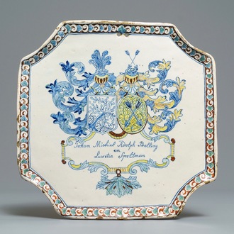 A Dutch Delft polychrome armorial marriage plaque, ca. 1704