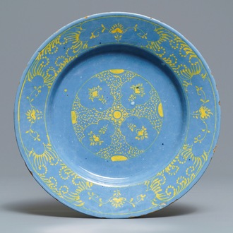 A rare Dutch Delft yellow on berettino-ground plate, 18th C.