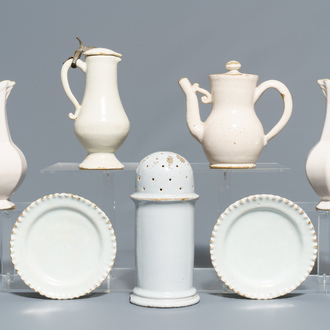 Four white Dutch Delft jugs, a pair of lobed plates and a large shaker, 17/18th C.
