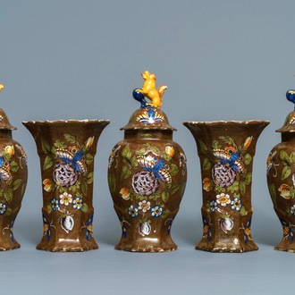 A polychrome Dutch Delft five-piece 'capucin brown-ground' garniture, 18th C.