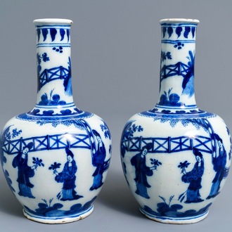A pair of Dutch Delft blue and white chinoiserie bottle vases, 1st half 18th C.