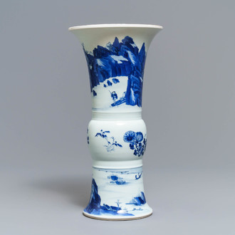 Een Chinese blauw-witte gu vaas met landschapsdecor, Kangxi merk en periode