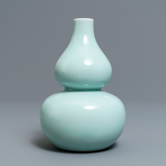 A Chinese monochrome celadon double gourd vase, Qianlong mark, 19th C.