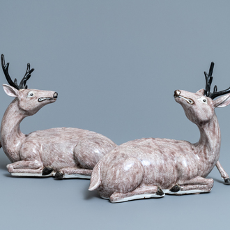A pair of large Chinese aubergine-glazed models of recumbent deer, 18/19th C.