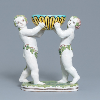 Een polychrome aardewerken groep met twee Bacchusfiguren in Brusselse stijl, Geo Martel, Dèsvres, begin 20e eeuw