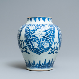 Een Chinese blauw-witte vaas met florale panelen, Kangxi