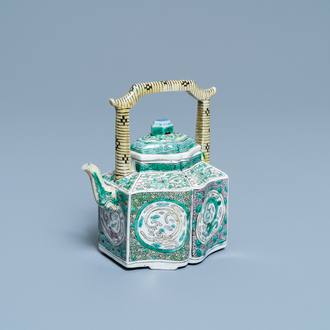 A Chinese verte biscuit teapot and cover, Kangxi
