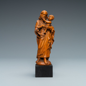 Een palmhouten figuur van Jozef met kind, Vlaanderen, 17e eeuw