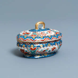 A polychrome and gilded Dutch Delft spice box and cover, early 18th C.