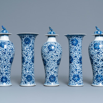 A Chinese blue and white five-piece garniture with floral design, 19th C.
