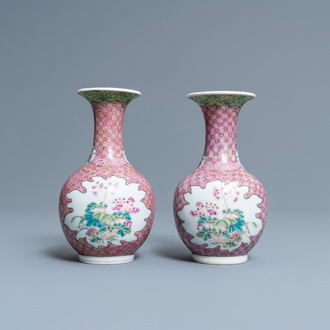 A pair of Chinese famille rose bottle vases with floral design, 19/20th C.