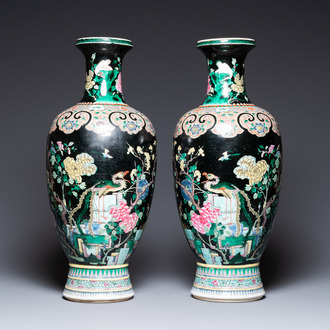 A pair of Chinese famille noire vases, 19th C.