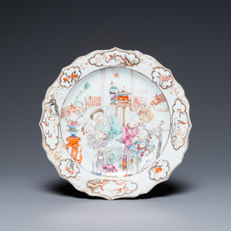 A Chinese famille rose 'mandarin tea drinkers' plate, Qianlong