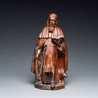 Een eikenhouten groep van de lezende Sint-Antonius met varken, 17e eeuw