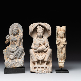 A Gandhara grey schist sculpture of the Bodhisattva Maitreya, a sculpture of a master with a child and a fragment of a divinity, 1/5th C.