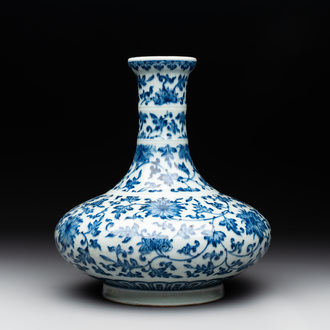 A Chinese blue and white 'lotus scroll' bottle vase, 18/19th C.