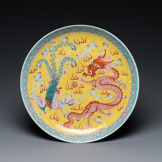 A Chinese famille rose yellow-ground 'dragon and phoenix' dish for the Straits or Peranakan market, Qianlong mark, 19th C.