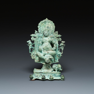 A bronze group with Kubera on throne, Central Java, Indonesia, 11/12th C.