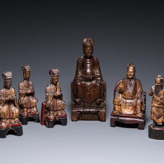 Six Chinese gilt-lacquered wooden sculptures of dignitaries and a guard, Ming and later