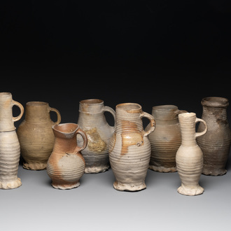 A collection of 8 German proto stoneware ribbed jugs, including 'Jacobakans', 14th C.