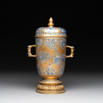 A Chinese gilt-ground blue and white lidded beaker on a French gilt bronze foot, Kangxi