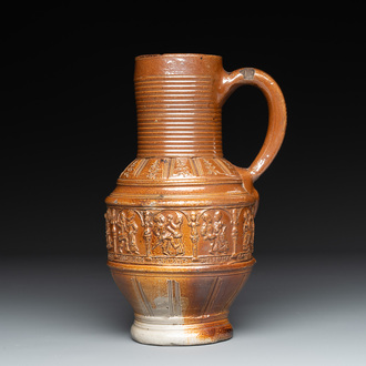 A Raeren stoneware 'peasant dance' jug, late 16th C.