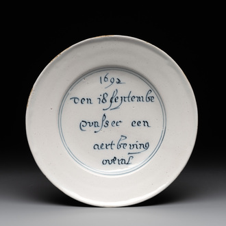 A rare Dutch Delft blue and white 'earthquake' plate, dated 1692