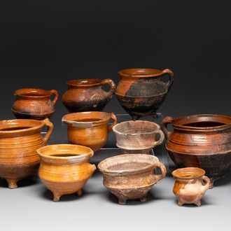 A collection of 10 parcel-glazed pottery so-called ‘grapen’, tripod cooking pots, 14th/17th C.