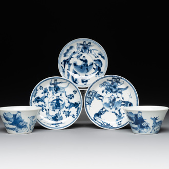 Two Chinese blue and white cups and three saucers with figural design, Kangxi and later