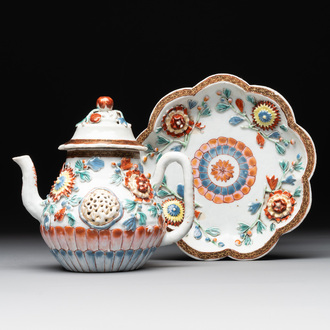 A Chinese famille rose teapot and stand with floral relief design, Qianlong