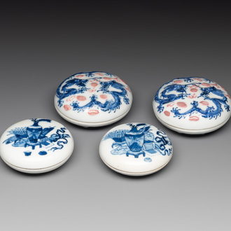 A pair of Chinese blue and white and a pair of blue, white and copper-red seal paste boxes, Kangxi and Qianlong mark, 19th C.