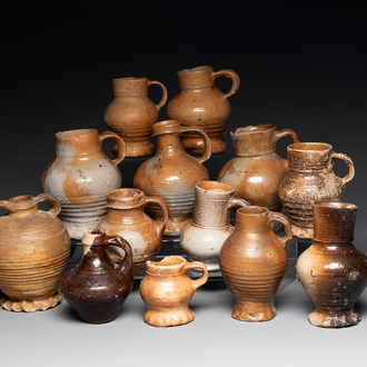 A collection of 13 German stoneware jugs, 15th C. and later