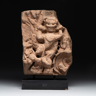 An Indian architectural red sandstone fragment with a divinity, 13th C.