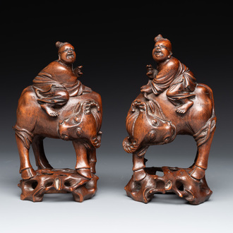 A pair of Chinese carved bamboo groups of a boy riding a buffalo, 19/20th C.
