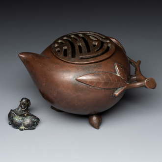 A Chinese bronze camel-form paperweight and a peach-shaped covered censer, 19th C.
