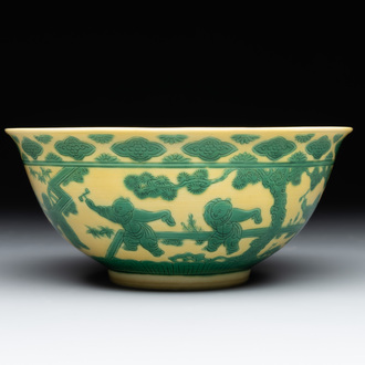 An imperial Chinese green-enamelled yellow-ground 'playing boys' bowl, Yongzheng mark and of the period