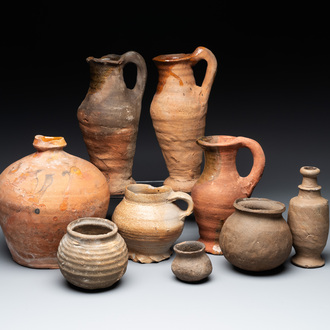 A collection of 9 German proto stoneware jugs and vessels, 14th C.