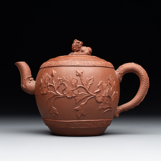 A Chinese Yixing stoneware teapot with relief design, Kangxi