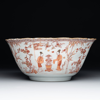 A Chinese iron-red and gilt-decorated 'ladies in a garden' bowl, Kangxi