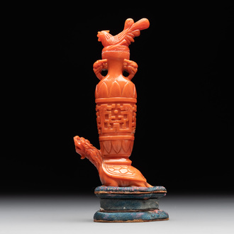 A Chinese carved red coral 'mythical animals' snuff bottle on stand, 19/20th C.