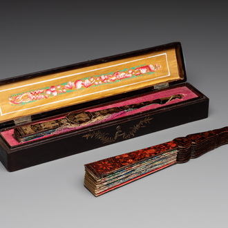 Two Chinese Canton gilt-lacquered and painted paper fans, one with original box, 19th C.