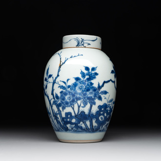 A Chinese blue and white jar and cover with birds among flowering branches, Transitional period