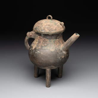 A Chinese inscribed archaic bronze tripod ritual wine vessel and cover, 'He 盉', Western Zhou