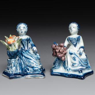 A pair of polychrome Dutch Delft groups of merchant ladies, 18th C.