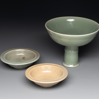 A Chinese Longquan celadon stem cup and two saucers, Ming