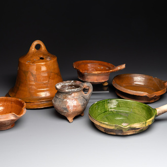 A collection of five glazed pottery cooking utensils and a fire bell, probably The Netherlands, 17th C.