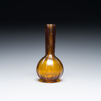 A Chinese translucent amber-coloured Peking glass bottle vase, Qianlong mark, 19/20th C.