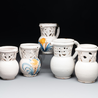 Three French white-glazed and two polychrome puzzle jugs, Nevers, 18th C.