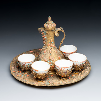An Ottoman coral-and-turquoise-inlaid gilt-copper tea service with five Chinese wucai cups, 19th C.